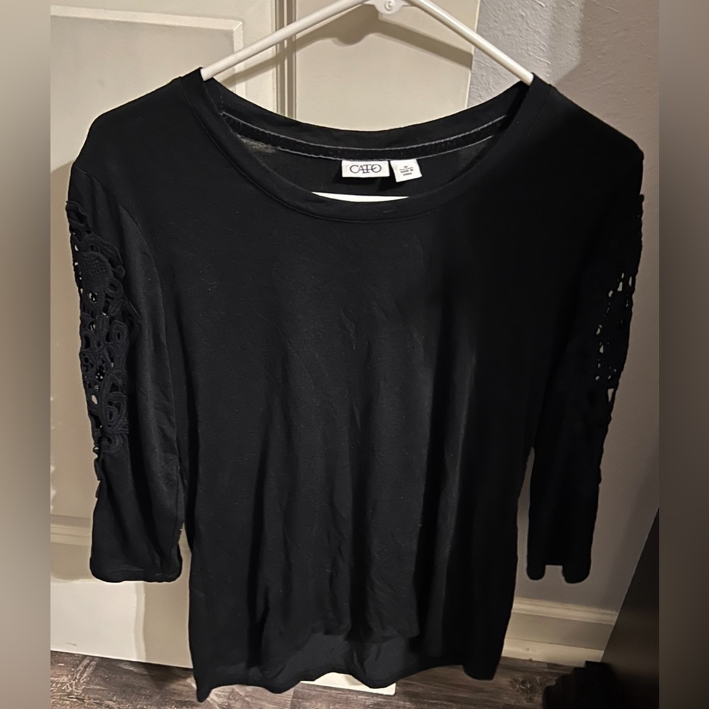 Beautiful medium shirt from Cato. It is black with pretty sleeves. Never worn!